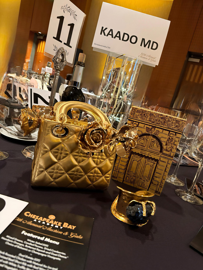 Table with Kaado MD sign at Chesapeake Bay Academy 30th Annual Auction and Gala